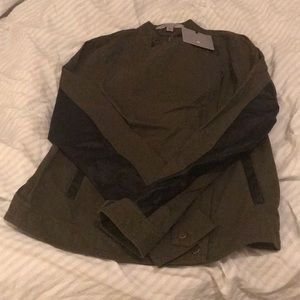 An olive and black sleeve faux leather jacket.
